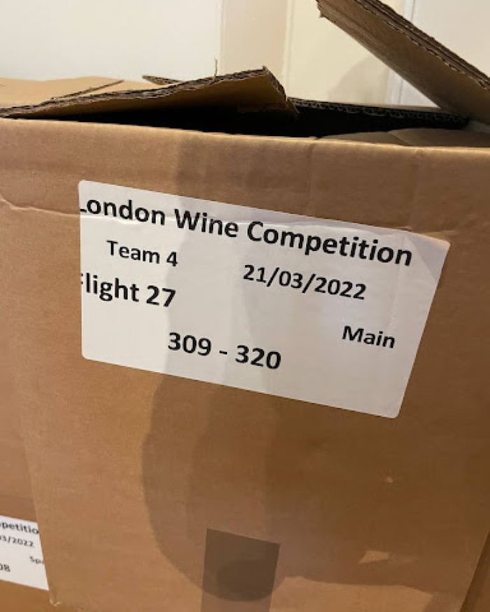 Each box is marked with a flight number and a tasting order number